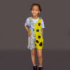 Child in a grey and yellow spotted jumper – studio photo