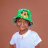Smiling boy wearing a green children's hat
