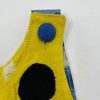 Giraffe tail and spot appliqué on children's jumper